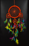 Orange Dream Catcher With Multicolored Feather.